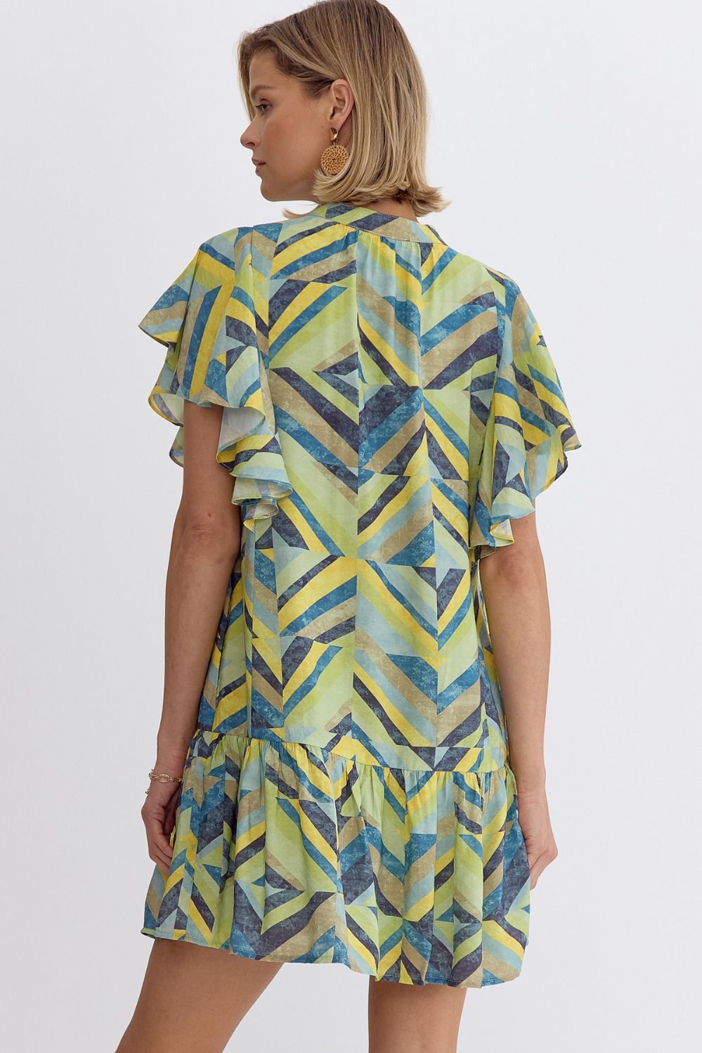 Printed flutter sleeve mini dress featuring pocket at sides.