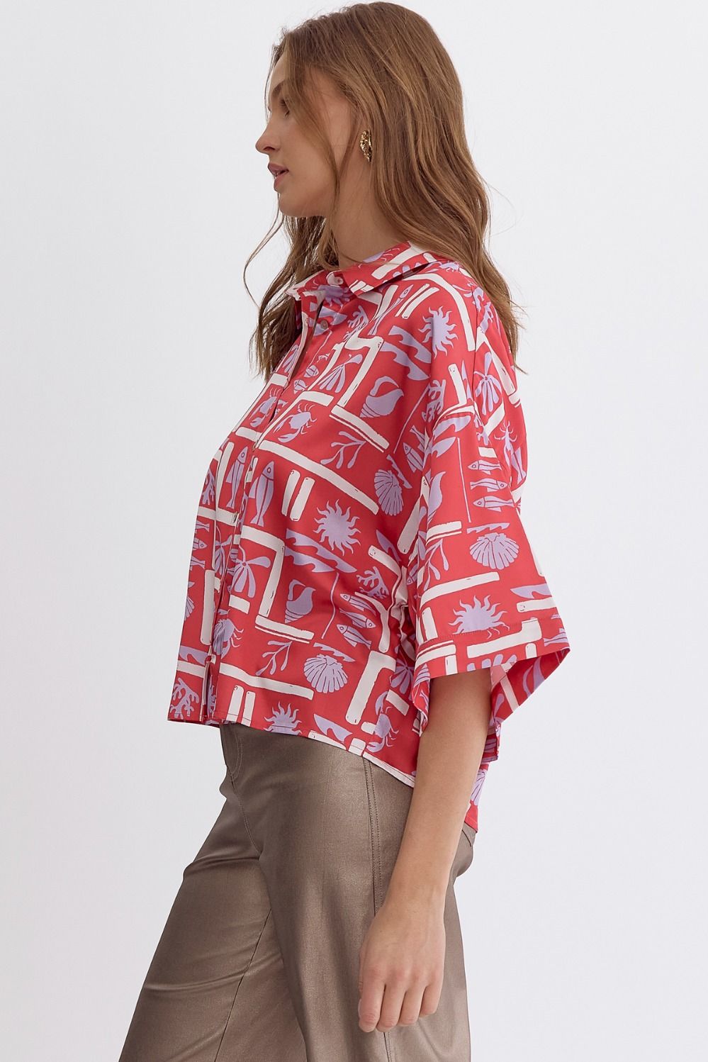Printed button down collared half sleeve top.