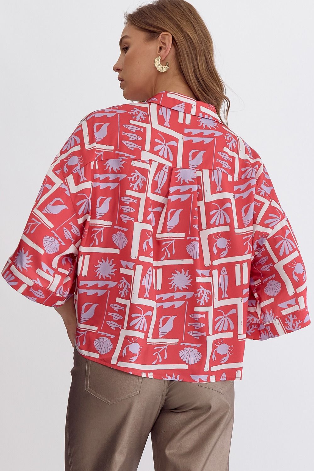 Printed button down collared half sleeve top.