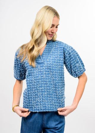 Ivy Jane Indigo Clip Dot Top in textured indigo blue with puff sleeves and split V-neck