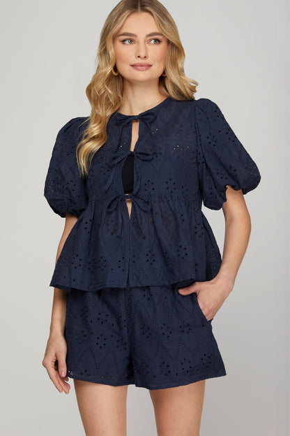 PUFF SLEEVE BOW FRONT TIE EYELET PEPLUM TOP