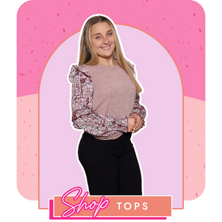 Woman wearing a floral blouse with a pink background and 'Shop Tops' text.