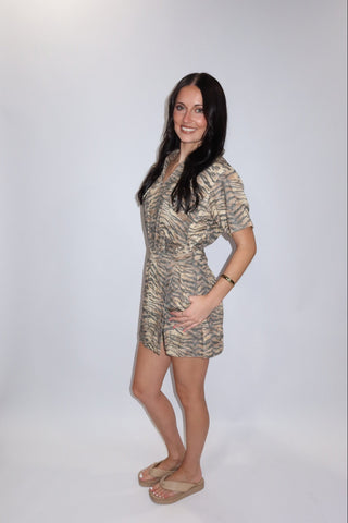 Wild Side Denim Romper side view showing wrap front skirt overlay and scalloped hem