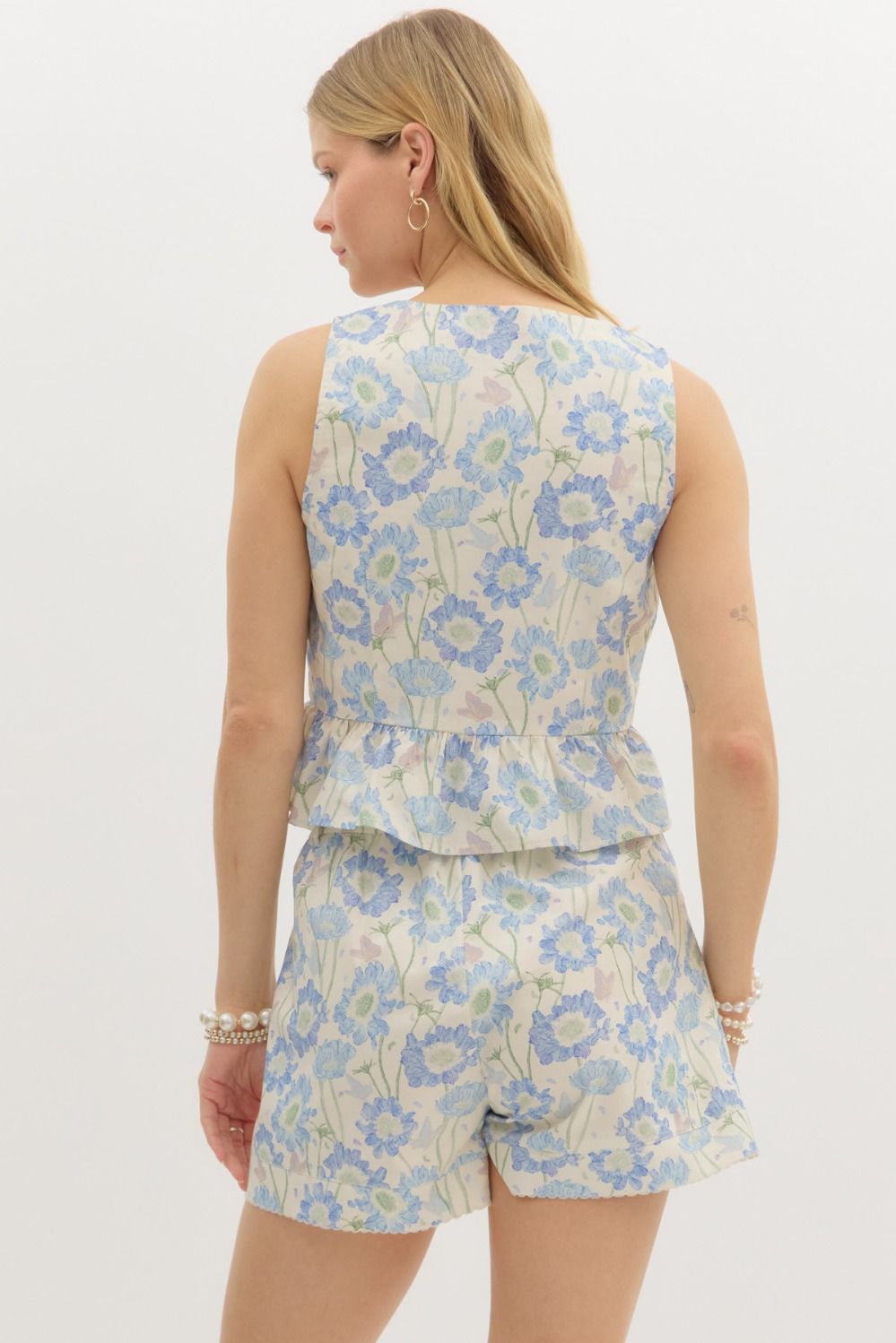 Floral print sleeveless ruffle hem top
